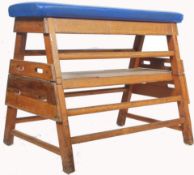 A Vintage 20th century gym vault horse with the original upholstery  finish on an open pine