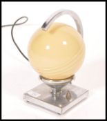 A 1930's Art Deco chrome and glass globe desk  / table lamp. The chrome square plinth base with