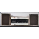 Hitachi - Model ST-3401E -  A retro 1973 stereo cassette recorder and player encased in a teak