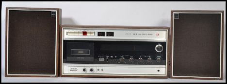 Hitachi - Model ST-3401E -  A retro 1973 stereo cassette recorder and player encased in a teak