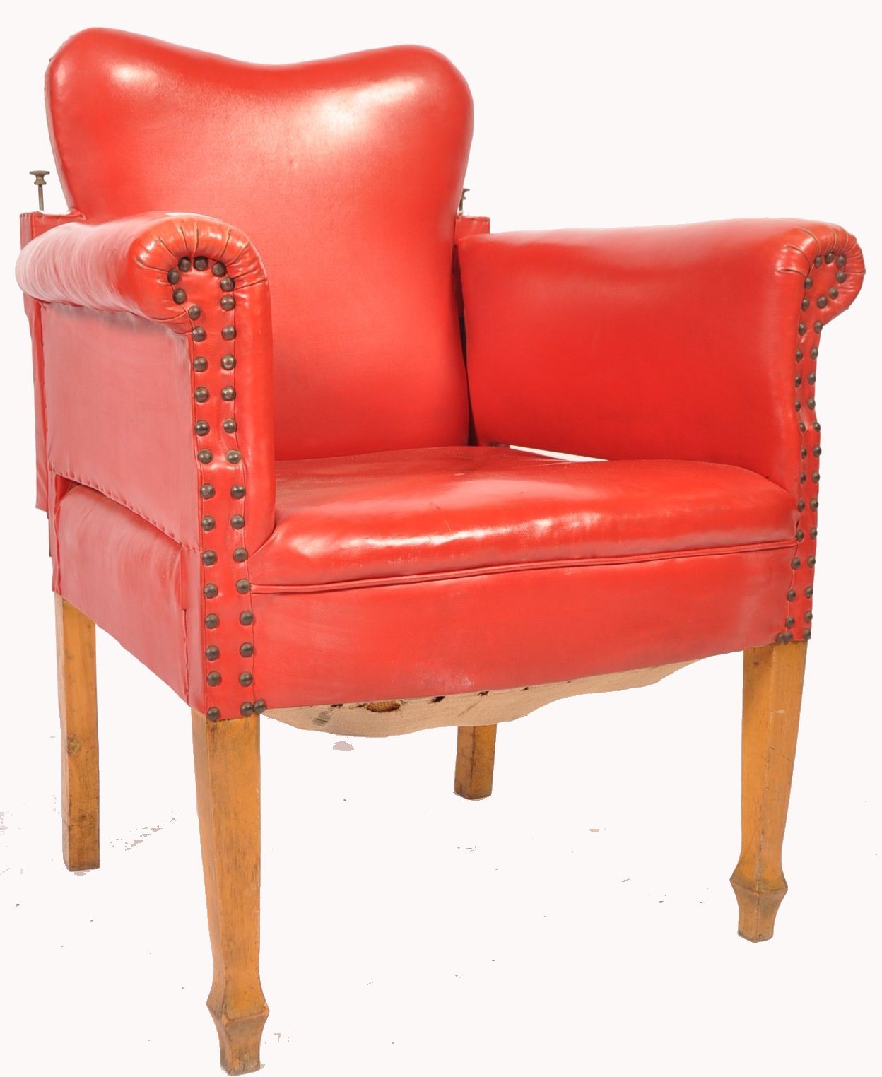 An early 20th century red leather barbers chair. The chair raised on beech wood tapering square legs