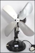 A vintage retro 20th century industrial desk top fan. The ebonised fan having steel fan blades.