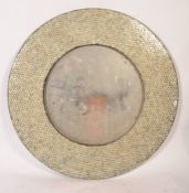 A 20th century large circular wall mirror, the mirror frame having a mosaic style finish being