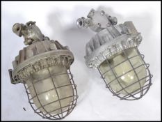 A good pair of Industrial heavy extreme condition drop pendant bulkhead lights of large form with