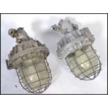 A good pair of Industrial heavy extreme condition drop pendant bulkhead lights of large form with