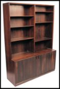 A superb Danish teak bookcase cabinet. With adjustable shelves and storage below. A high quality