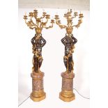 A decorative pair of 20th century large Venetian style Blackamoor floor standing standard lamps.