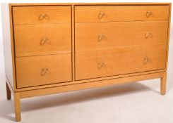 A mid century retro oak chest of drawer by John & Sylvia Reid for Stag Furniture. The chest of