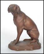 A 1930's Art Deco style continental plaster figure of a hunting dog - labrador in a seated