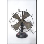 A vintage early 20th century Industrial cast iron and brass electric desk fan, circa 1930s