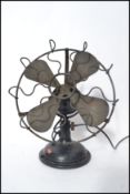 A vintage early 20th century Industrial cast iron and brass electric desk fan, circa 1930s