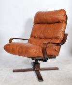 Ring Mekanikk - A Norwegian retro 20th century vintage swivel lounge chair, having a bentwood base
