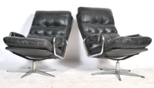 A pair of Scandinavian mid 20th century retro vintage swivel easy lounge chairs having a chromed
