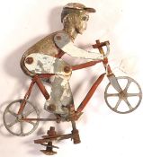 A vintage early 20th century circa 1920's French Folk Art modelled as a bicycle racer created from