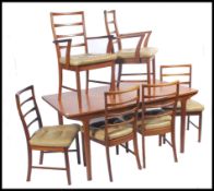 An original mid century Mcintosh of Kirckcaldy teak wood dining table and 6 chairs suite The table