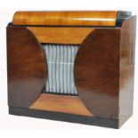 A stunning mid 20th century Defiant radiogram, speaker grill too the centre of the cabinet, lift