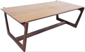 A 1970's Danish influence teak wood coffee - occasional table being raised on shaped supports with a