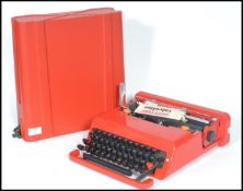 A vintage retro 20th century industrial Italian Valentine portable typewriter designed by Ettore