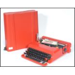 A vintage retro 20th century industrial Italian Valentine portable typewriter designed by Ettore