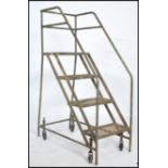 A stunning  vintage / retro industrial - Library - mobile ladder constructed from a tubular metal