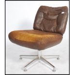 A stunning retro mid 20th century brown leather swivel / office chair, raised on a chrome base