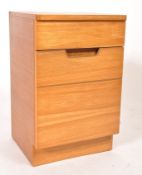 A retro mid century teak wood Uniflex bedside cabinet of pedestal form having single drawers and