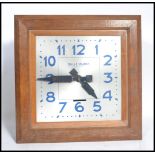 A vintage early 20th century French Art Deco Bulle Electrique Oak Wall Clock, with 15 1/2 in. square