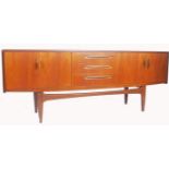 A 1970's - 20th century G-Plan ' Fresco ' pattern teak wood sideboard raised on tapering legs with a