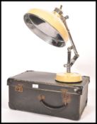 A good mid century vintage enamel and polished stainless steel heat lamp by Heala complete in the