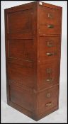 An early 20th century industrial oak upright office filing cabinet. Pedestal form with bank of 4