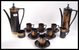 Two vintage retro 20th century part coffee services having black grounds. One having gilt Greek