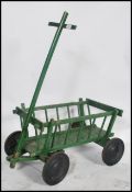A vintage 20th century painted dog cart constructed from pine,