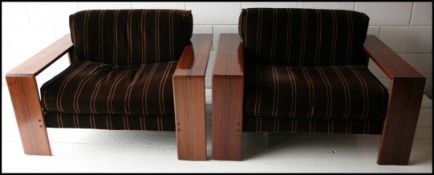 A rare pair of 1970s ' Artona ' dark wood armchairs. Designed by Afra & Tobias Scarpa for Maxalto.