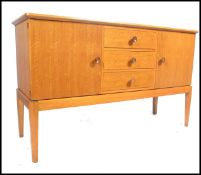 An original Gordon Russell walnut sideboard / dresser. Raised on squared legs with a chest to centre
