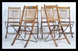 Davista - A set of 1920's early 20th century industrial oak folding chapel / hall chairs. The chairs