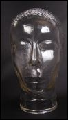 A 20th century moulded pressed glass phrenology type head - shop display stand / millinery mannequin