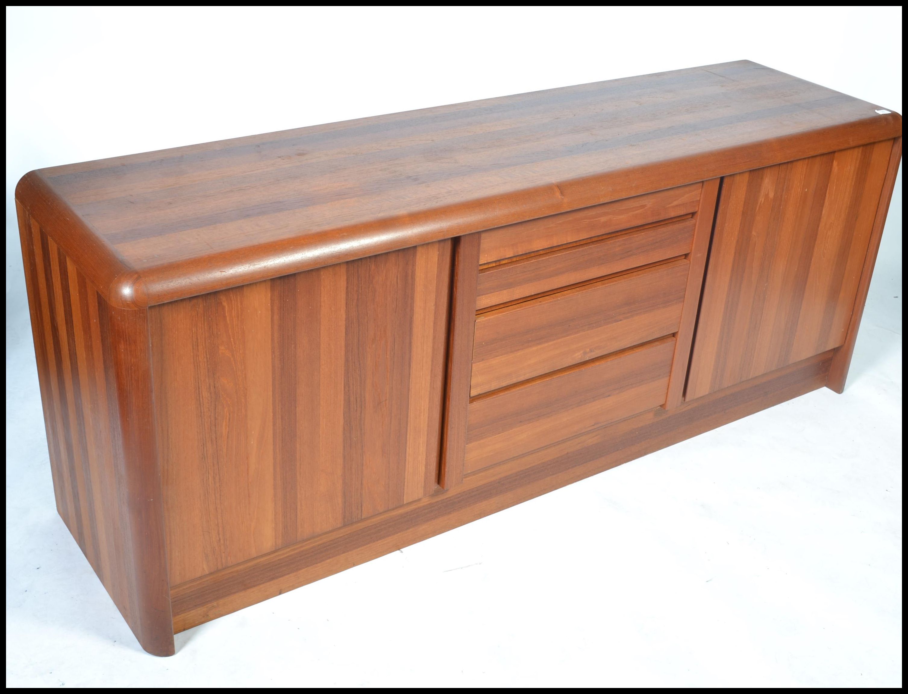 A 20th century Danish sideboard of low form and heavy solid teak construction by Ejvind Johansen - Image 2 of 7