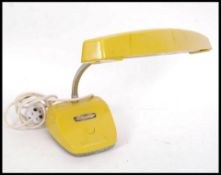 A 1960's Italian vivid yellow believed Italian goose neck desk lamp having adjustable chrome neck