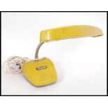 A 1960's Italian vivid yellow believed Italian goose neck desk lamp having adjustable chrome neck