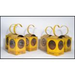 A group of 6 Batchlee yellow painted metal road / railway 3 aspect hanging oil lamps complete with