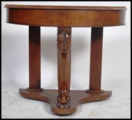 A Victorian mahogany Duchess console table being r