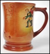 A Royal Doulton tankard having polychrome decorati