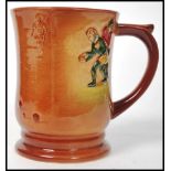 A Royal Doulton tankard having polychrome decorati