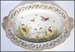 A 19th century ceramic platter meat tray depicting