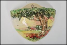 A Royal Doulton cottage scene wall pocket / font D