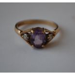 A hallmarked 9ct gold three stone ring set with a