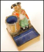 A Doulton Lambeth match striker, saltglaze, c1925