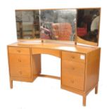 A mid century retro dressing table chest by John &