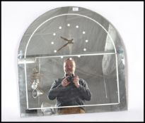 A 1930's Art Deco mirror clock. The mirror of arch