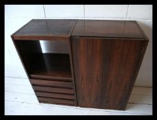 A 1970's retro teak wood veneer wall cabinet being